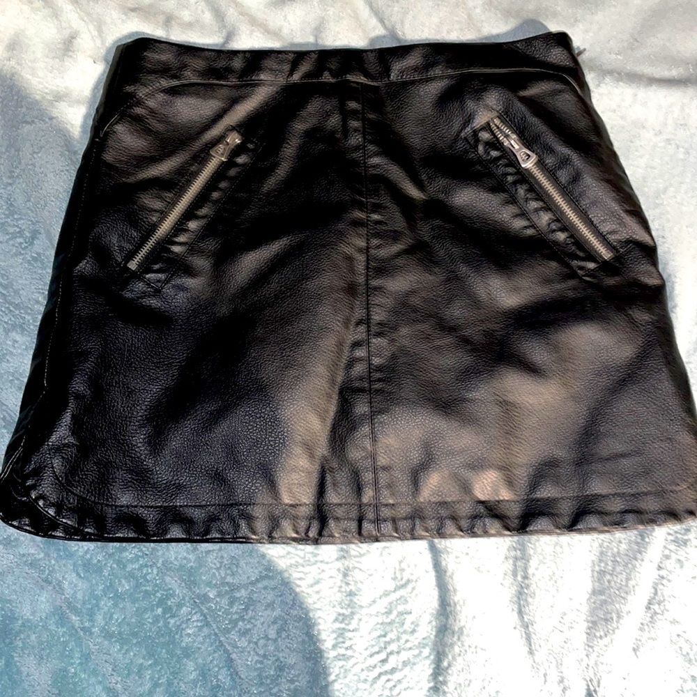 Leather halfway down thigh length skirt, zipper pockets